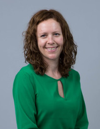 Hannah_Yardley seen in a green color dress and with a smile on her face